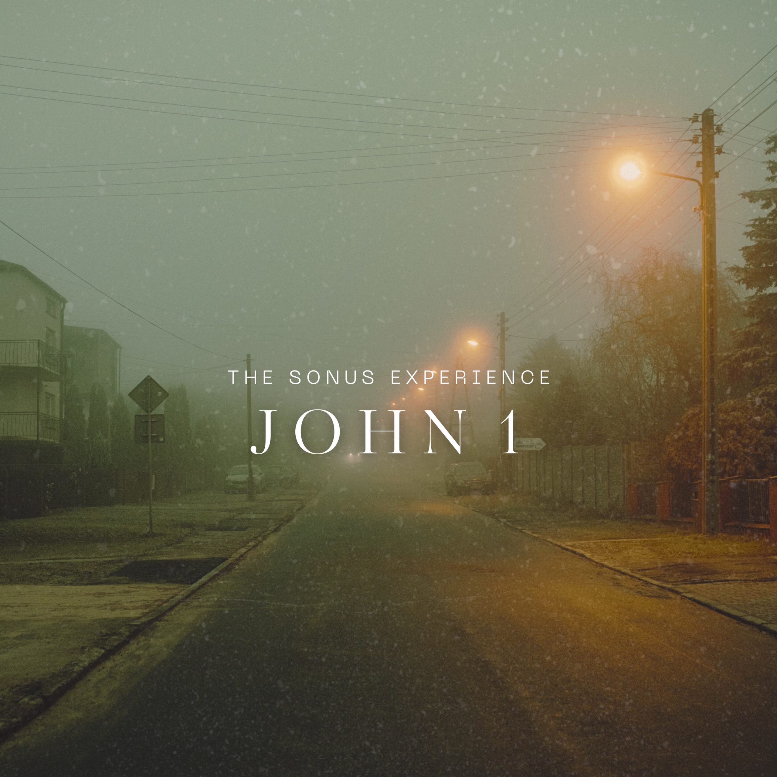 single cover with the song title, a misty road just after twilight in a neighborhood, streetlights on the right side of the street